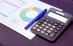 Calculator And Pen And Chart